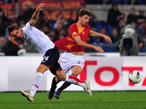 AS Roma forward Fabio Borini (R) fights