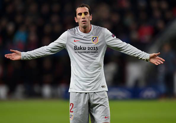 Atletico Madrid's Uruguayan defender Diego Godin reacts during the UEFA Champions League first-leg, round of 16 football match Bayer 04 Leverkusen vs Club Atletico de Madrid in Leverkusen, western Germany on February 25, 2015.    AFP PHOTO /  PATRIK STOLLARZ        (Photo credit should read PATRIK STOLLARZ/AFP/Getty Images)