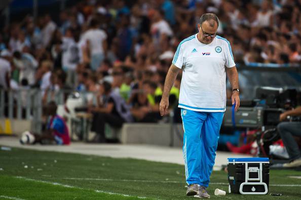 Marseille's Argentinian head coach Marcelo Bielsa looks down during the French L1 football match between Olympique de Marseille and Stade Malherbe de Caen on August 8, 2015 at the Velodrome stadium in Marseille, southern France. Marcelo Bielsa stunned French football on August 8 when he quit as coach of Marseille just minutes after his team had lost their season opener 1-0 at Caen. "I have resigned from my post as manager of Marseille," the Argentine announced at the end of his post-match news conference. AFP PHOTO / BERTRAND LANGLOIS        (Photo credit should read BERTRAND LANGLOIS/AFP/Getty Images)