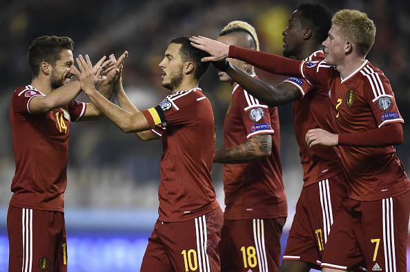 Belgium's midfielder Eden Hazard (2nd L) is congratulated by teammates after scoring a goal during the Euro 2016 qualifying football match between Belgium and Israel, at the King Baudouin Stadium, on October 13, 2015 in Brussels. AFP PHOTO / JOHN THYS (Photo credit should read JOHN THYS/AFP/Getty Images)