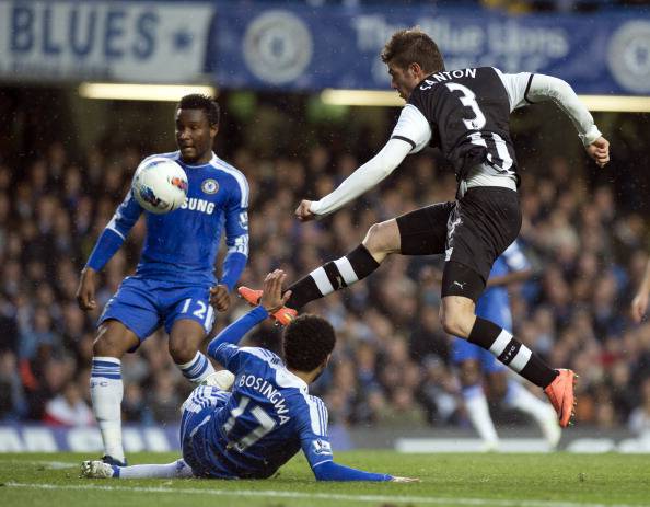 Newcastle United's Davide Santon (R) hit
