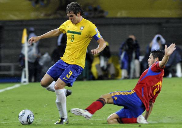 Brazil's player Bruno Uvini (L) vies for